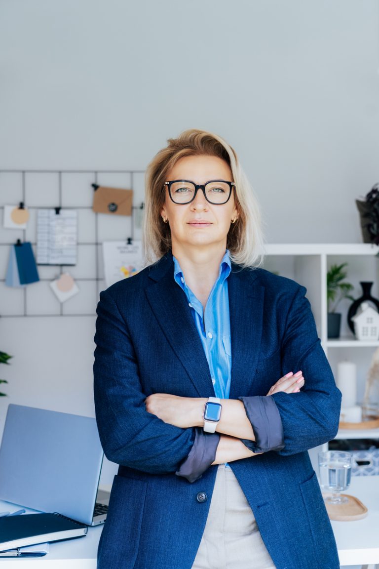 Portrait of 50's stylish, confident mature businesswoman, middle age company ceo director, experienced senior female professional, business coach team leader in modern office. Female leader. Vertical.